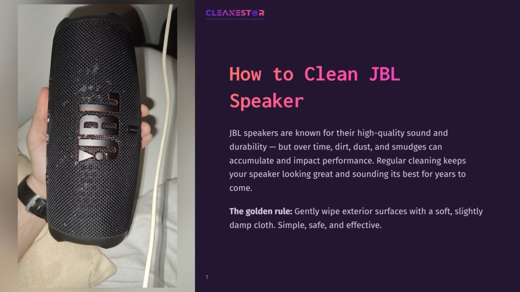 A Black Jbl Portable Speaker Is Held In A Hand, With The &Quot;Jbl&Quot; Logo Visible. The Image Is Part Of A &Quot;How To Clean Jbl Speaker&Quot; Guide.