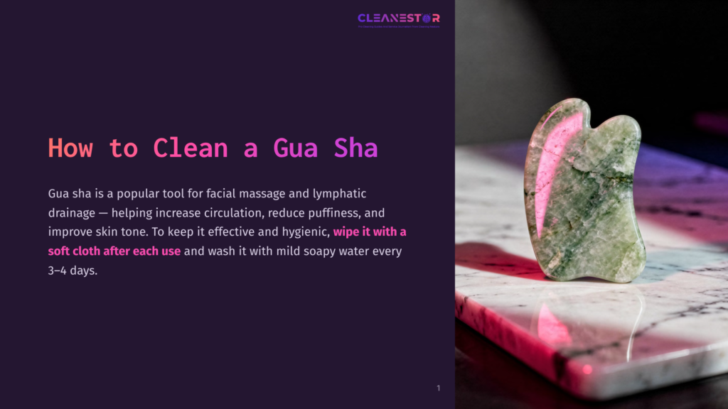 1 How To Clean A Gua Sha A Green Jade Gua Sha Tool, Shaped Like A Leaf, Rests On A Pink Marble Surface, With A Small Splash Of Water Nearby, Ready For Facial Massage And Lymphatic Drainage.
