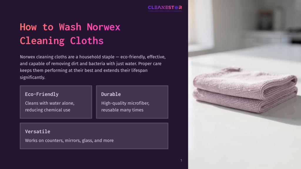 Two Folded Norwex Cleaning Cloths In A Soft Lilac Color Are Neatly Stacked On A White Countertop, With A Blurred Background Of A Modern Kitchen.