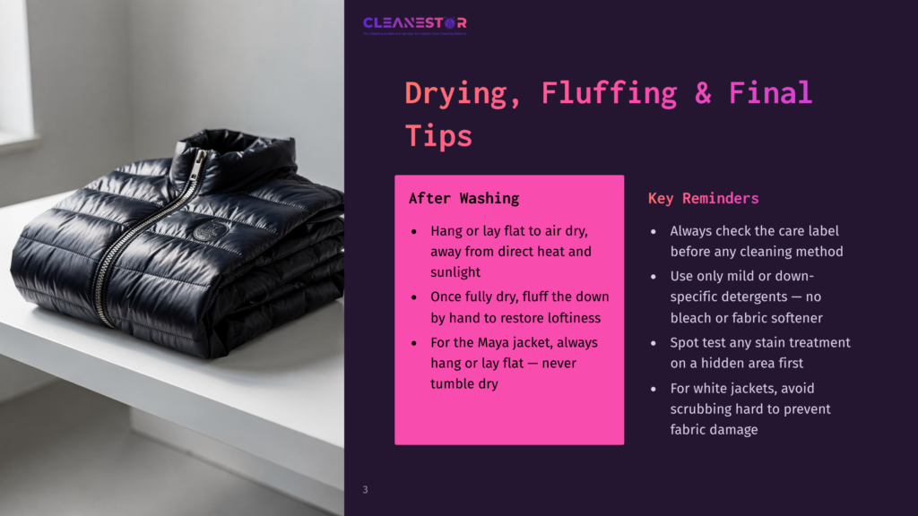 A Black Puffer Jacket With A Zipper And Collar Rests On A White Shelf, With A Blurred Background. The Text &Quot;Cleanestor&Quot; Is Visible In The Upper Right Corner.