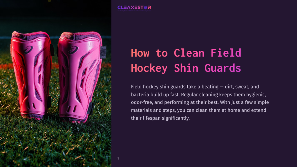 Close-Up Of Bright Pink Field Hockey Shin Guards Resting On Vibrant Green Artificial Turf, With The Cleanestor Logo Visible In The Top Right Corner.