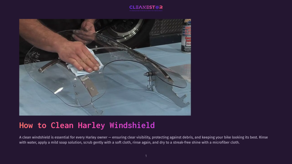 A Person'S Hand With A White Cloth, Cleaning A Clear Harley Windshield. A Can Of Cleaning Solution Sits On The Table Behind The Windshield.