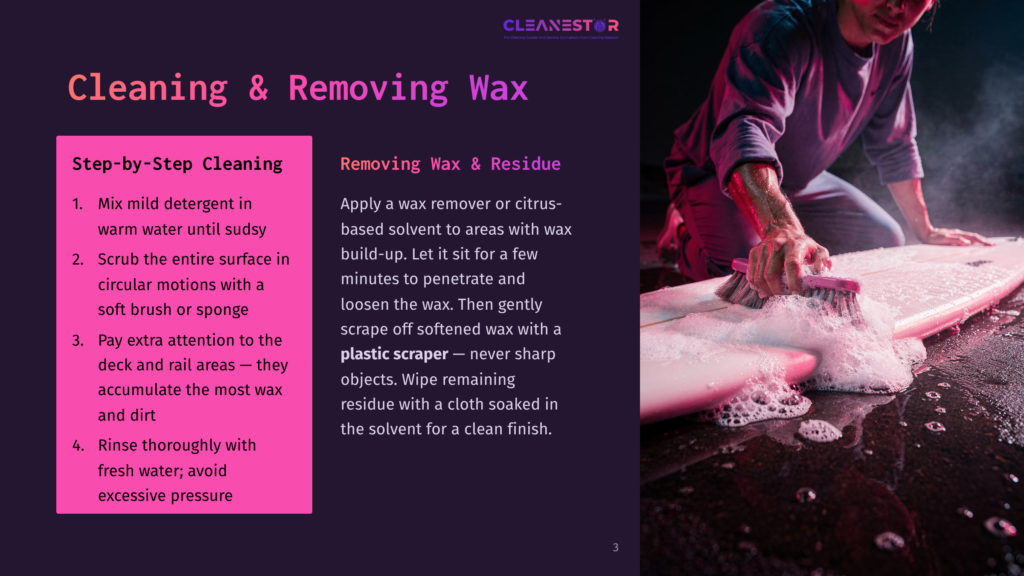 A Person In A Gray Shirt And Purple Pants Cleaning A Pink Surfboard With A Brush, Using A Wax Remover Or Citrus-Based Solvent. The Surfboard Is On A Wet, Gray, Cracked Concrete Surface.