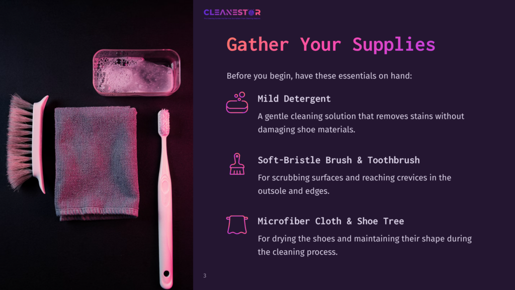 3 Gather Your Supplies 7 A White Toothbrush, A Grey Microfiber Cloth, And A Pink-Handled Brush Rest Next To A Small Dish Of Soapy Water On A Dark Surface. The Image Is From A &Quot;Cleanestor&Quot; Guide On Gathering Shoe Cleaning Supplies.