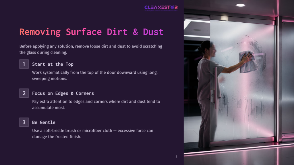 A Person In Light-Colored Scrubs Cleans A Frosted Glass Sliding Door With A Gray Cloth, Removing Surface Dirt And Dust. The Door Is Smudged With Condensation And Dirt, With The Cleanestar Logo Visible At The Top.
