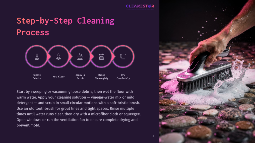 A Cleaning Brush With Pink Bristles Scrubs A Stone Floor Covered In Soapy Water, Illustrating The &Quot;Cleanestor Cleaning Process&Quot; Step-By-Step Guide.