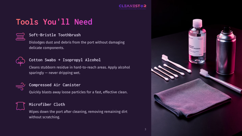 Cleanestor Cleaning Tools: Soft-Bristle Toothbrush, Cotton Swabs With Isopropyl Alcohol, Compressed Air, And Microfiber Cloth On A Dark Surface Next To Cleaning Supplies.
