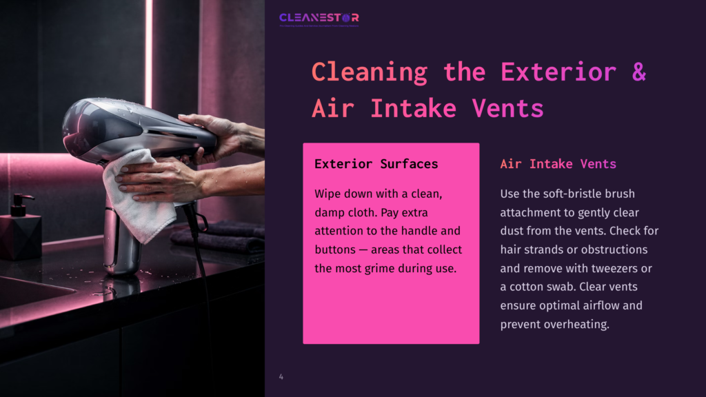 4 Cleaning The Exterior And Air Intake Vents A Person'S Hands Use A White Cloth To Clean A Sleek, Grey Handheld Vacuum Cleaner In A Modern Bathroom Setting With Dark Tiled Walls And A Countertop.