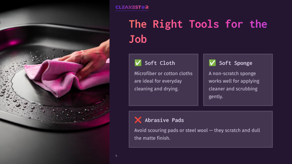 A Hand Gently Wipes A Wet, Stainless Steel Sink With A Pink Microfiber Cloth, Showing Water Droplets And The &Quot;Cleanestor&Quot; Logo And Cleaning Tips.