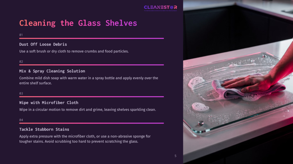 5 Cleaning The Glass Shelves A Hand With A Gray Microfiber Cloth Cleans A Wet Glass Shelf, Creating Suds, As Part Of A Guide On Cleaning Glass Shelves.
