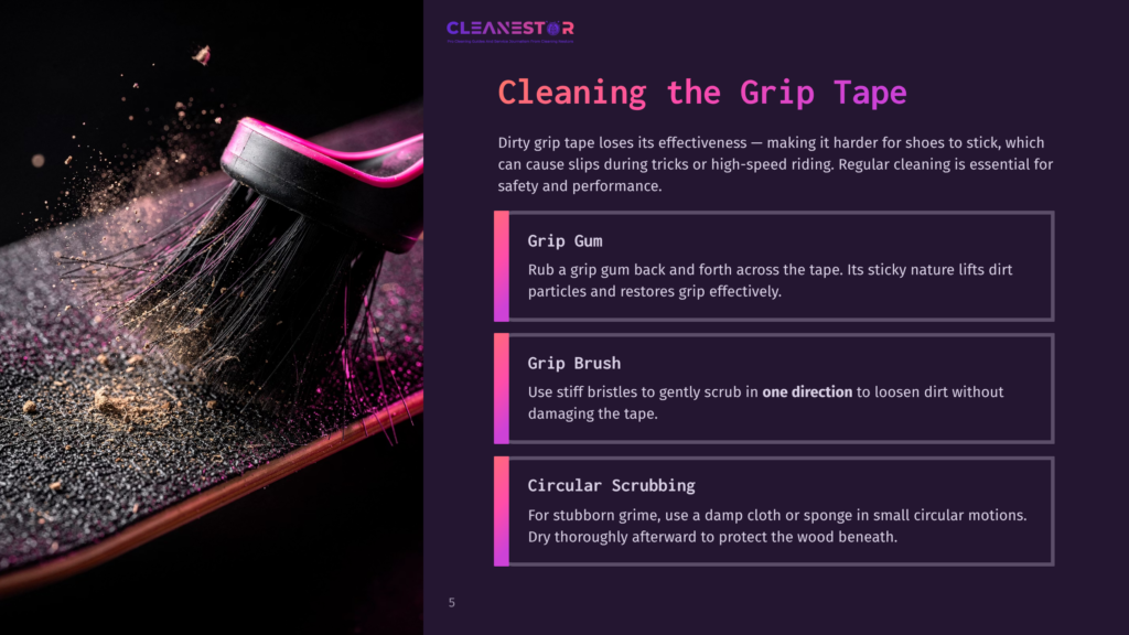 Close-Up Of A Black Skateboard Deck With A Pink And Black Grip Tape Brush Cleaning Off Dirt And Debris, Illustrating Grip Tape Cleaning Tips.