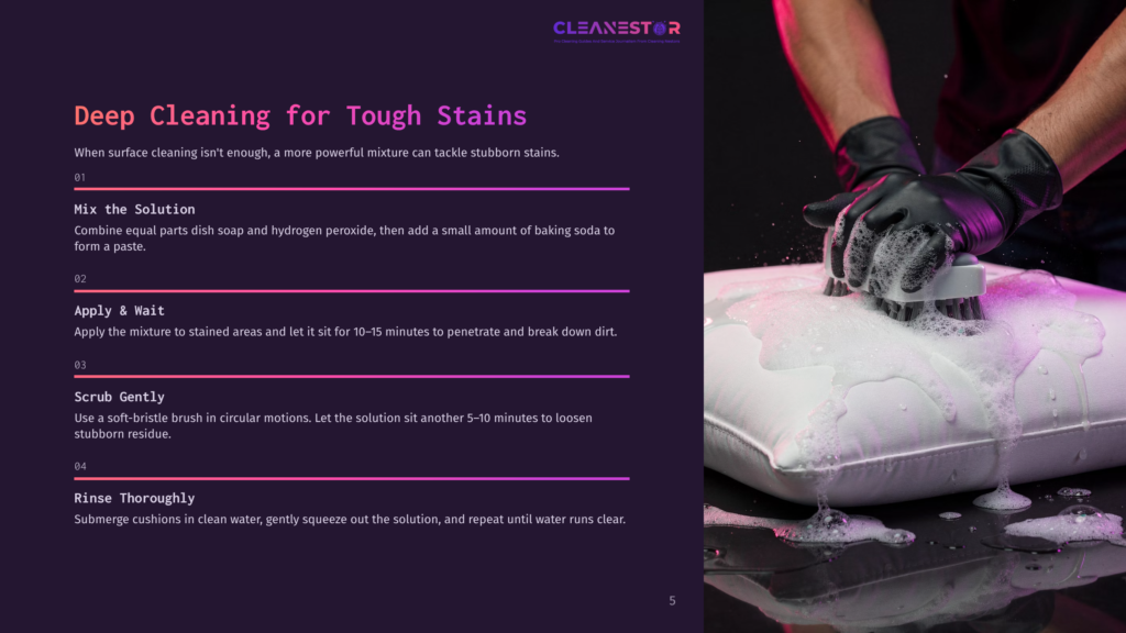 5 Deep Cleaning For Tough Stains A Person Wearing Black Gloves Scrubs A White Cushion With A Brush, Creating A Foam As Part Of A Deep Cleaning Process For Tough Stains.