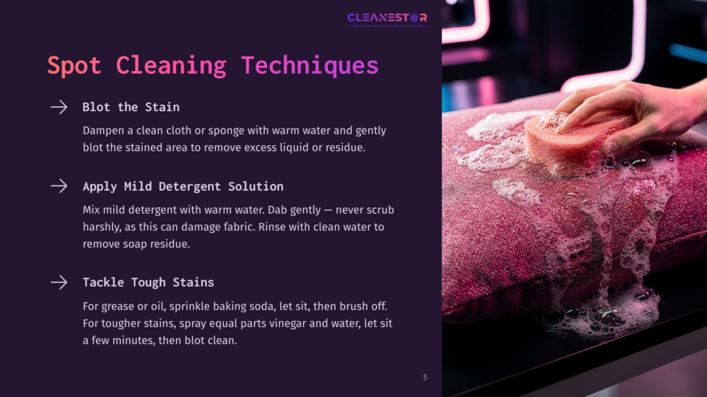 A Hand Gently Dabs A Textured Pink Cushion With A Wet Sponge, Creating A Foamy Lather. The Cushion Is On A Dark Surface, Suggesting A Furniture Cleaning Demonstration.