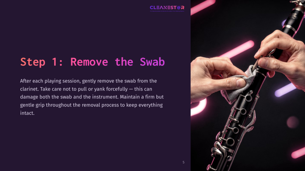 Step 1: Remove The Swab. Close-Up Of Hands Gently Cleaning A Clarinet With A Cloth, Highlighting Proper Maintenance.