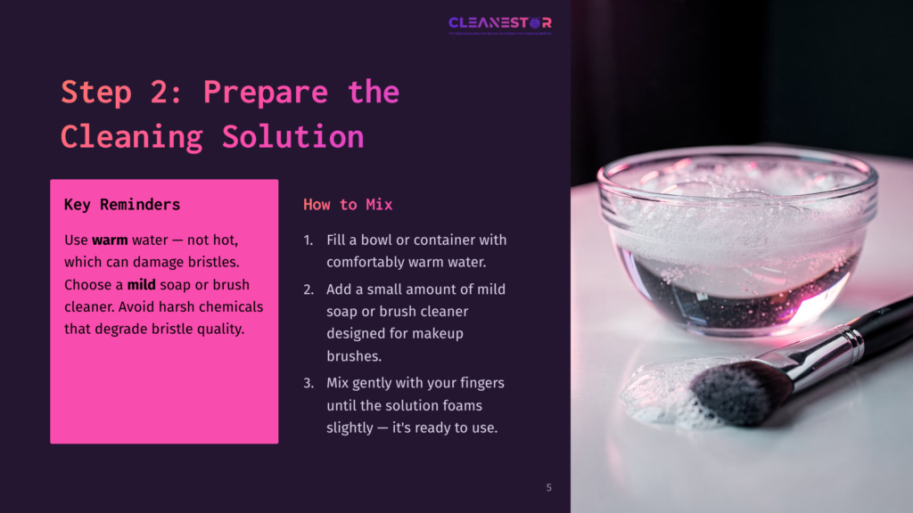 Step 2: Prepare The Cleaning Solution. A Makeup Brush With Soapy Bristles Rests On A Surface Next To A Bowl Of Warm, Soapy Water. Instructions For Mixing The Solution Are Visible On The Left.