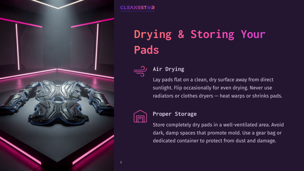 6 Drying And Storing Your Pads A Futuristic, Metallic Chest Plate And Shoulder Armor Lie Flat On A Dark, Reflective Surface, Illuminated By Vibrant Pink Neon Lights. The Armor Is Intricately Detailed, Showcasing A Complex, Segmented Design.