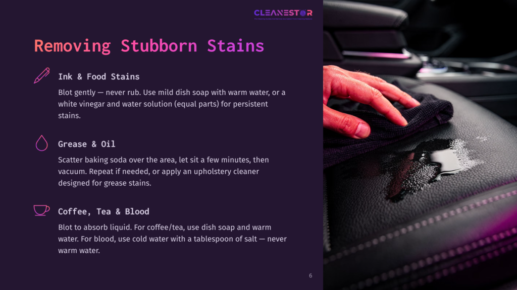 Close-Up Of A Hand In A Dark Cloth Blotting A Wet Stain On Black Leather Car Upholstery, With A Pink And Purple Neon Glow Reflecting On The Surface.