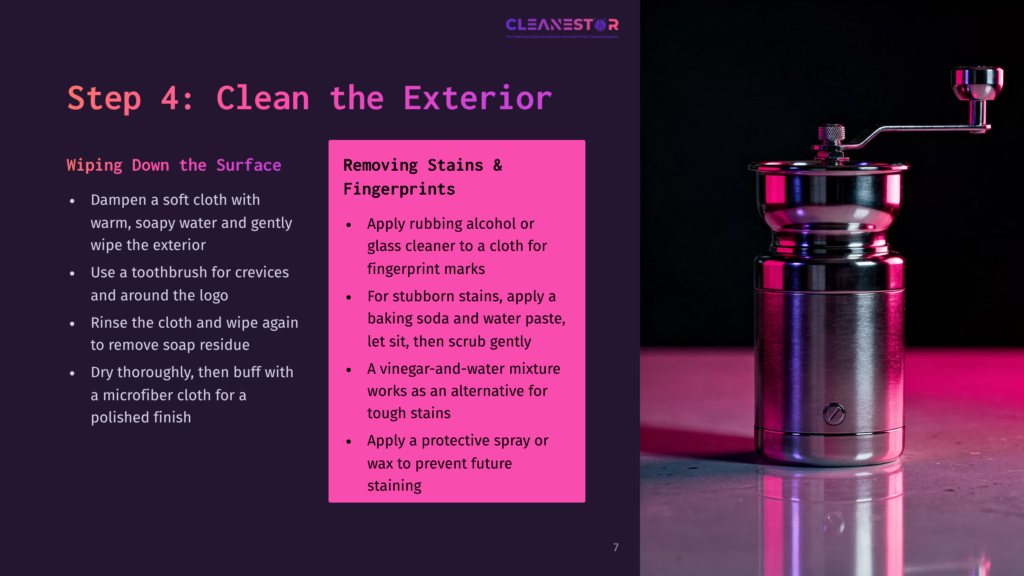 Step 4: Clean The Exterior - Removing Stains &Amp; Fingerprints From A Stainless Steel Coffee Grinder With A Manual Crank, Set Against A Dark, Moody Background With Pink Lighting.