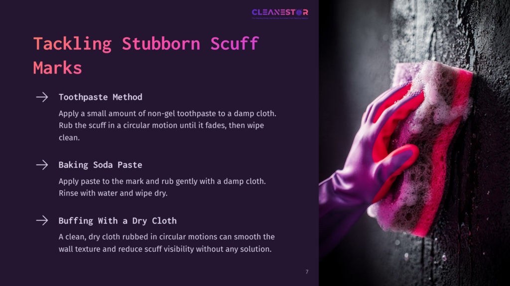 7 Tackling Stubborn Scuff Marks A Hand Wearing A Purple Glove Scrubs A Textured Dark Wall With A Pink Sponge, Demonstrating A Cleaning Method For Stubborn Scuff Marks.