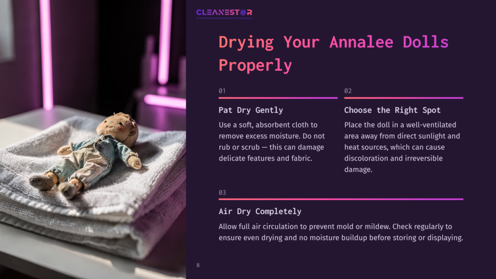 A Small, Worn Teddy Bear Doll With A Denim Outfit Lies On A Folded White Towel, Being Gently Patted Dry. The Image Is Part Of A Guide On Drying Annalee Dolls Properly.