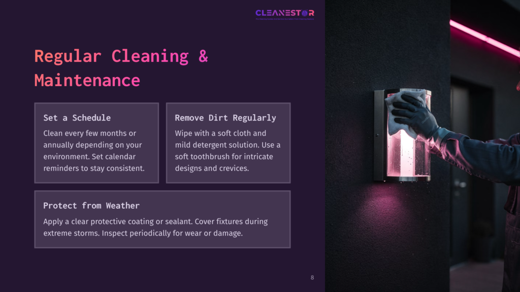 8 Regular Cleaning And Maintenance A Person In Blue Gloves Cleans A Modern Outdoor Light Fixture With A White Cloth. The Fixture Is Illuminated With Pink Light, And Water Droplets Are Visible On Its Glass Surface. The Background Is Dark, With A Pink Neon Light Strip Visible On The Right.