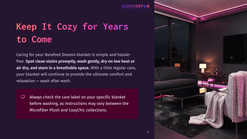 Cozy Living Room With A Grey Couch And Pink Throw Blanket, Featuring Large Windows Overlooking A City Skyline At Night.