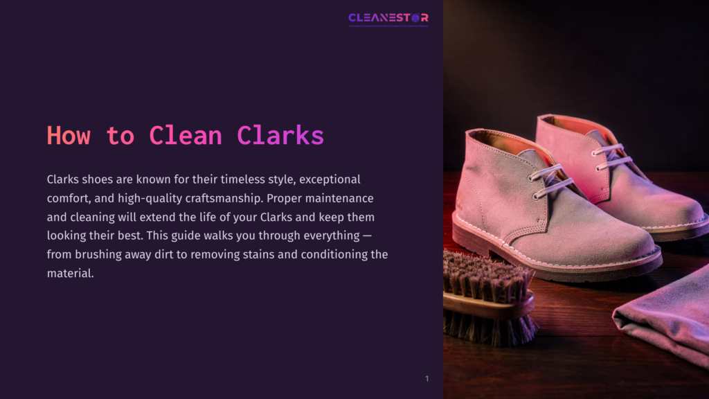 A Pair Of Light Grey Suede Clarks Chukka Boots Sit On A Wooden Surface Next To A Brush And A Folded Cloth, Bathed In Soft Pink And Purple Light, With The Title &Quot;How To Clean Clarks&Quot; Visible On The Left.