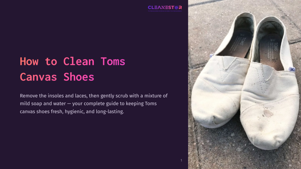 1 How To Clean Toms Canvas Shoes A Pair Of Well-Worn White Canvas Toms Shoes Sit On A Textured Gray Surface, One Shoe Showing A Noticeable Brown Stain. The Image Is A Close-Up, Highlighting The Texture Of The Canvas And The Casual, Lived-In Appearance Of The Footwear.