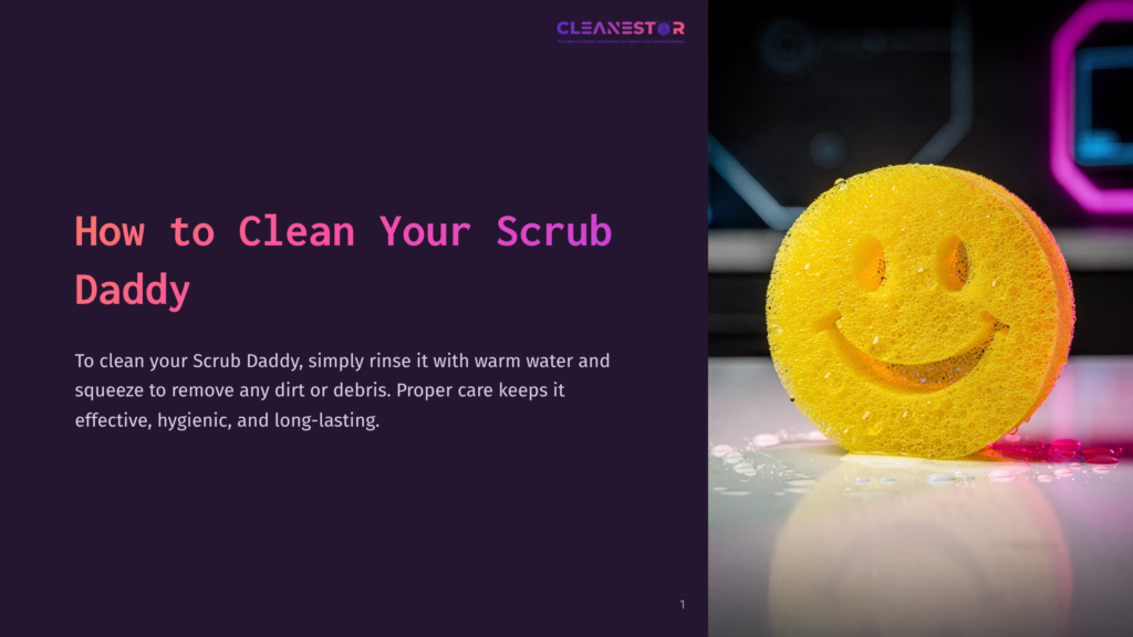 A Bright Yellow Scrub Daddy Sponge With A Smiley Face Is Wet And Sits On A White Surface With Water Droplets And Pink Liquid. &Quot;How To Clean Your Scrub Daddy&Quot; Is Written In Large Pink Text On The Left Side Of The Image.