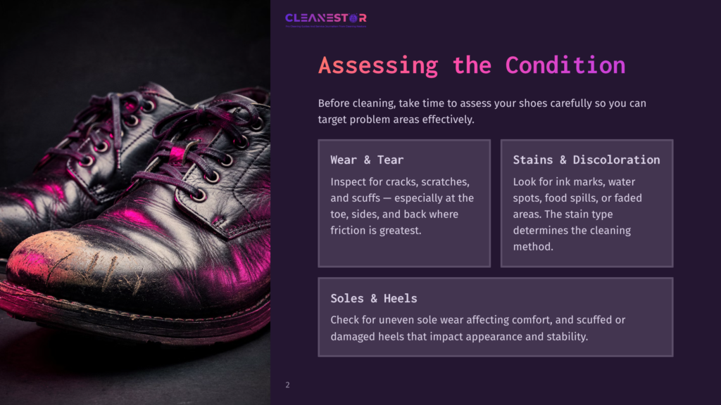 Close-Up Of Worn, Black Leather Dress Shoes Showing Scuffs And Dirt, With Pink Light Reflecting On The Left Shoe, Suggesting A Need For Cleaning And Repair.