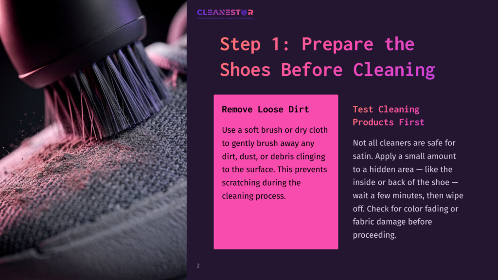 Close-Up Of A Cleaning Brush With Dark Bristles Gently Scrubbing A Grey, Textured Sneaker. Text Overlay Reads &Quot;Step 1: Prepare The Shoes Before Cleaning&Quot; And &Quot;Remove Loose Dirt&Quot;.