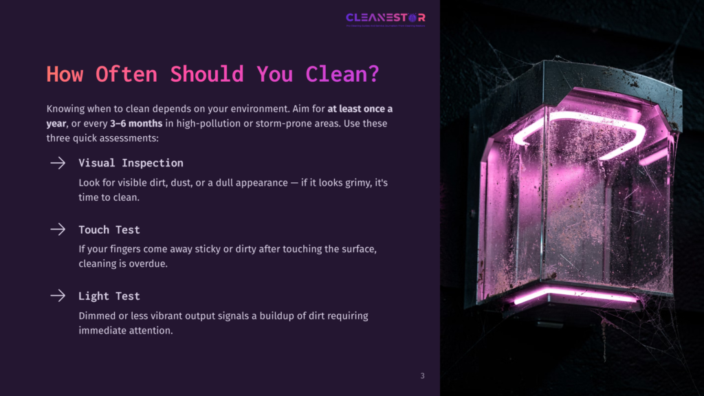 A Dusty, Grimy Light Fixture With Pink Neon Lighting, Covered In Cobwebs, Suggesting A Need For Cleaning.