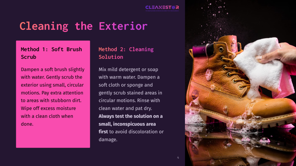A Hand Cleans A Brown Timberland Boot With A White Cloth, Suds And Water Splashing On The Shiny Black Surface. Text Overlays Provide Boot Cleaning Instructions.