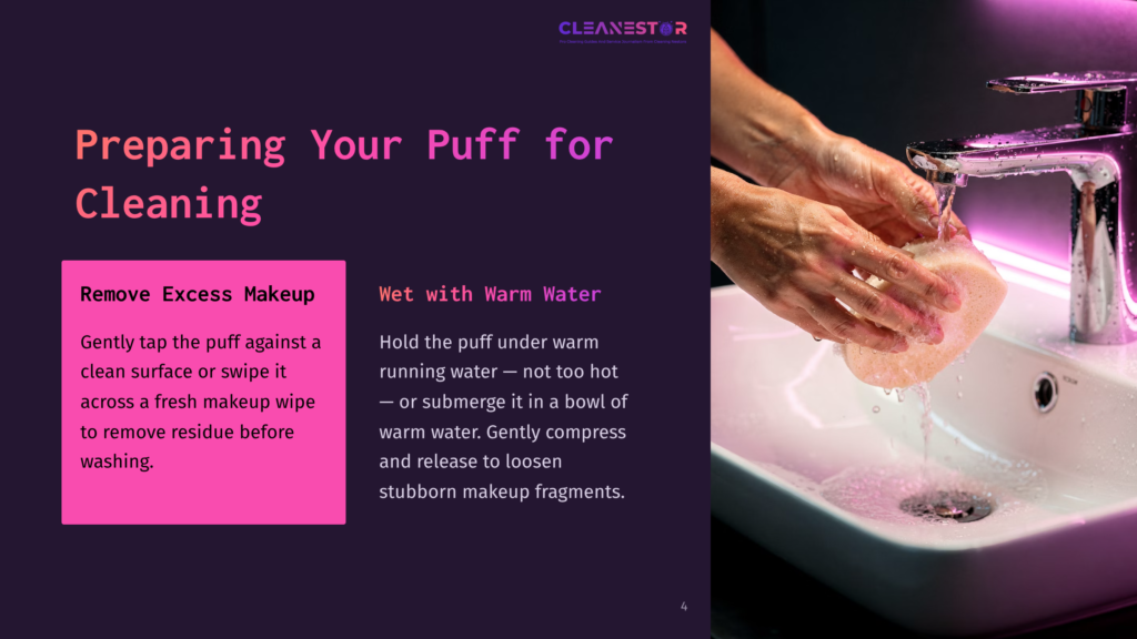 A Person’s Hand Holds A Makeup Puff Under Warm Running Water, With A Sink In The Background And Cleaning Instructions On The Left.