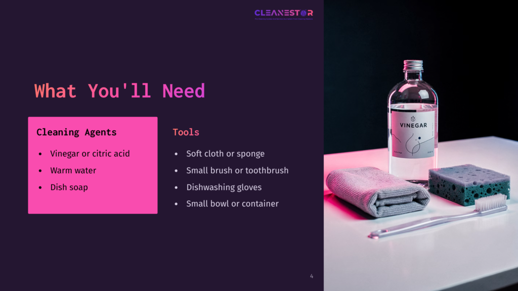 A Bottle Of Vinegar, A Small Brush, A Sponge, A Cloth, And Dishwashing Gloves Arranged On A White Surface With A Dark Background.