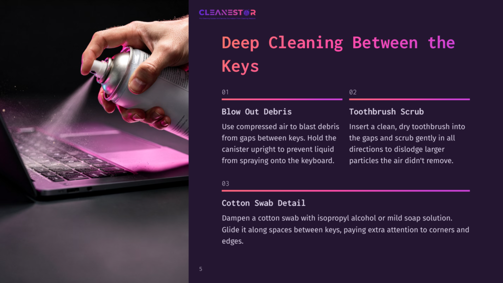 A Hand Holds A Can Of Compressed Air Spraying Between Keyboard Keys, With A Toothbrush And Cotton Swab Nearby On A Dark Background.