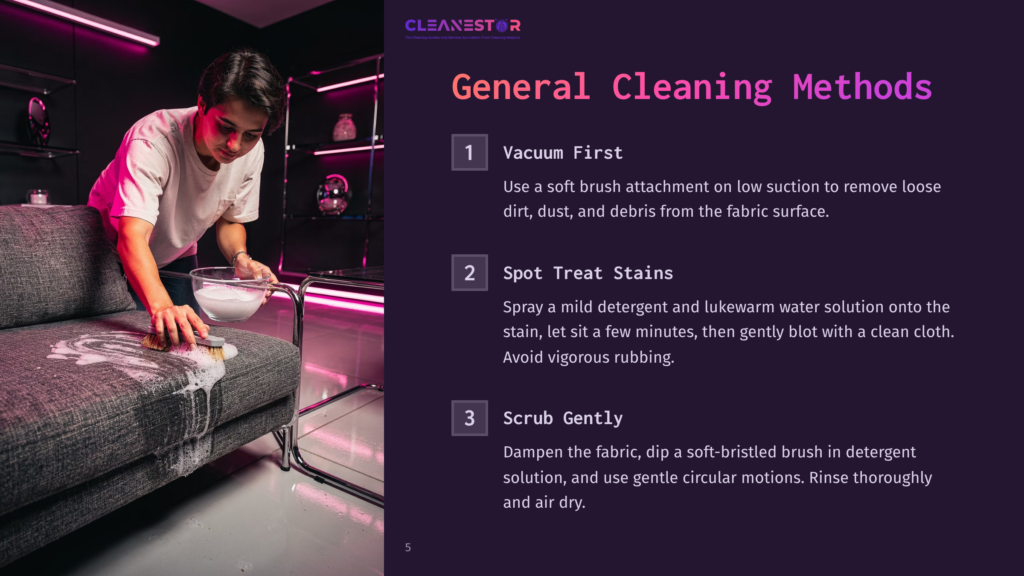5 General Cleaning Methods 1 A Person Cleans A Grey Sofa With A White Brush And Foam, Demonstrating Vacuum First, Spot Treat Stains, And Scrub Gently Cleaning Methods.