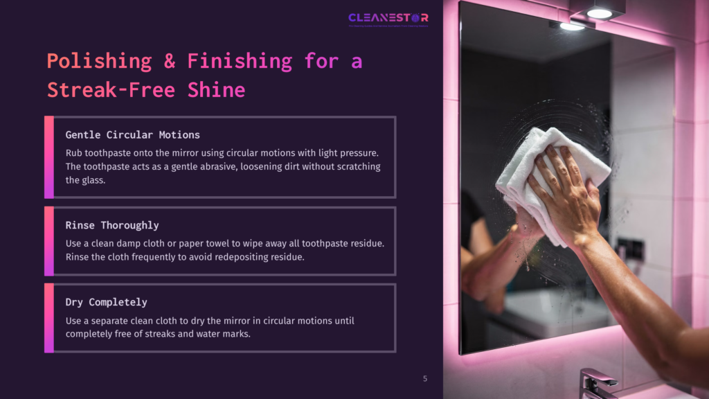 Person Using A Cloth To Clean A Mirror With Toothpaste. The Mirror Is Framed In Pink Light, And The Background Is A Bathroom.