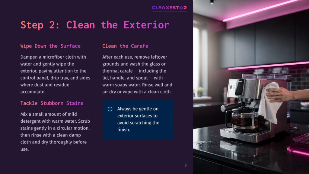 5 Step 2 Clean The Exterior 1 A Hand Wipes A Stainless Steel Espresso Machine With A White Cloth. The Machine Has A Glass Carafe And A Black Drip Tray. The Background Is A Modern Kitchen With Dark Cabinets And A Tiled Backsplash.