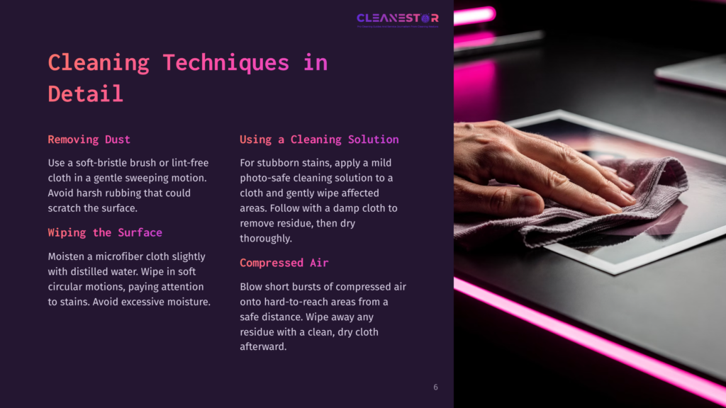 A Hand Gently Wipes A Tablet Screen With A Purple Microfiber Cloth, Demonstrating Cleaning Techniques For Electronics.