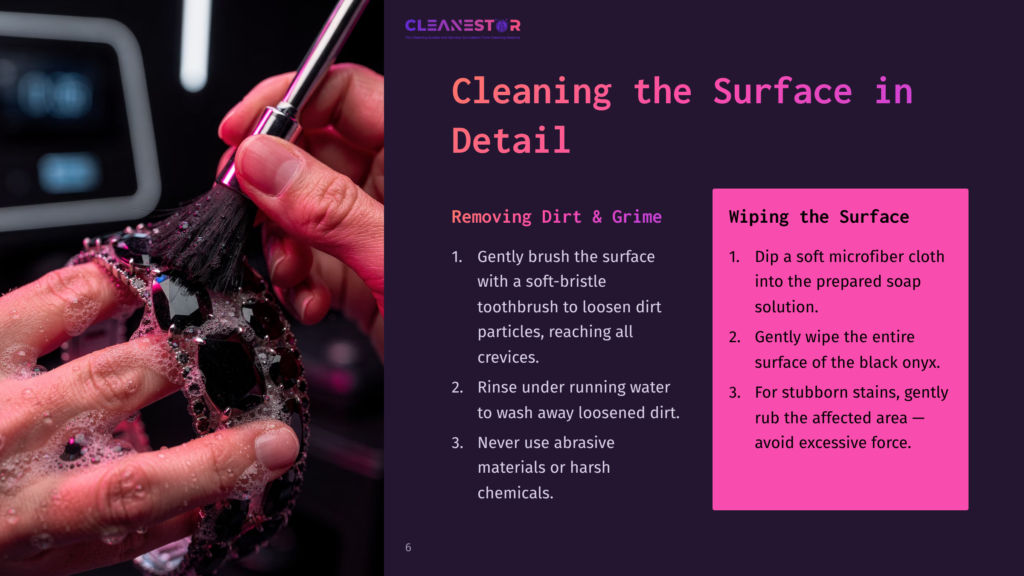 Close-Up Of A Hand Gently Cleaning A Black, Jeweled Surface With A Soft-Bristle Brush And Soapy Water. Text Overlay Reads &Quot;Cleaning The Surface In Detail&Quot; And &Quot;Removing Dirt &Amp; Grime.