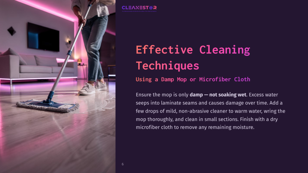 A Person Mops A Light-Colored Wood Floor With A Blue And White Mop, Leaving A Damp Sheen. The Text &Quot;Cleanestor&Quot; And &Quot;Effective Cleaning Techniques: Using A Damp Mop Or Microfiber Cloth&Quot; Is Visible.