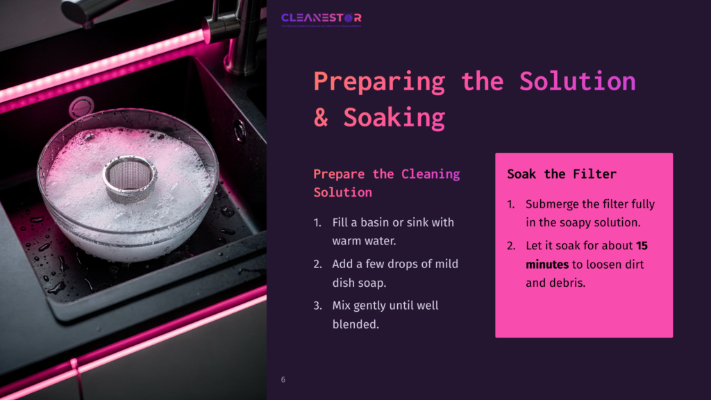 A Clear Bowl With A Round Filter Rests In Warm, Soapy Water, Beside A Dark Sink Illuminated By Pink Lighting. Instructions On Cleaning Are Displayed.