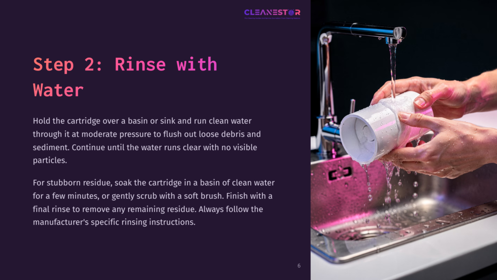 6 Step 2 Rinse With Water Hands Rinse A White Water Filter Cartridge Under Running Water In A Stainless Steel Sink, With &Quot;Cleanestor&Quot; Text Visible On A Purple Background.