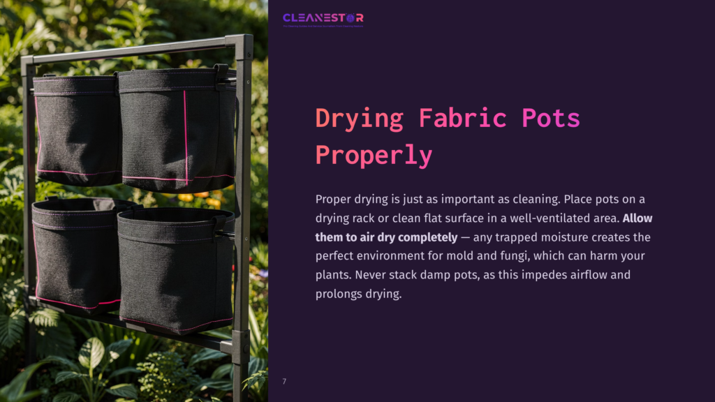 7 Drying Fabric Pots Properly Four Black Fabric Pots Hang On A Drying Rack In A Garden Setting, Surrounded By Greenery, Emphasizing Proper Drying Techniques.
