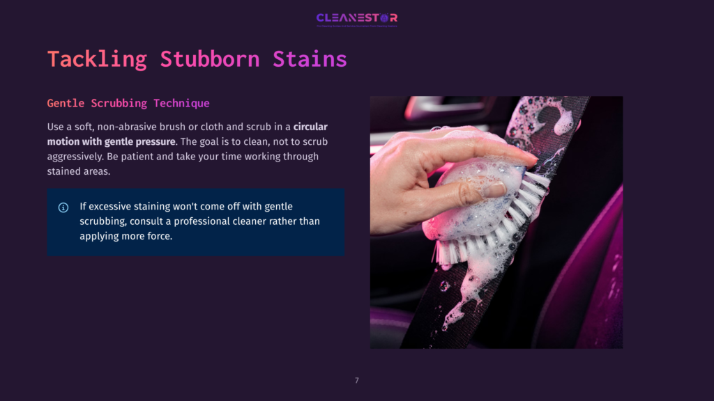 A Hand Gently Scrubs A Car Seatbelt With A Brush And Foam, Demonstrating A Gentle Cleaning Technique For Stubborn Stains.