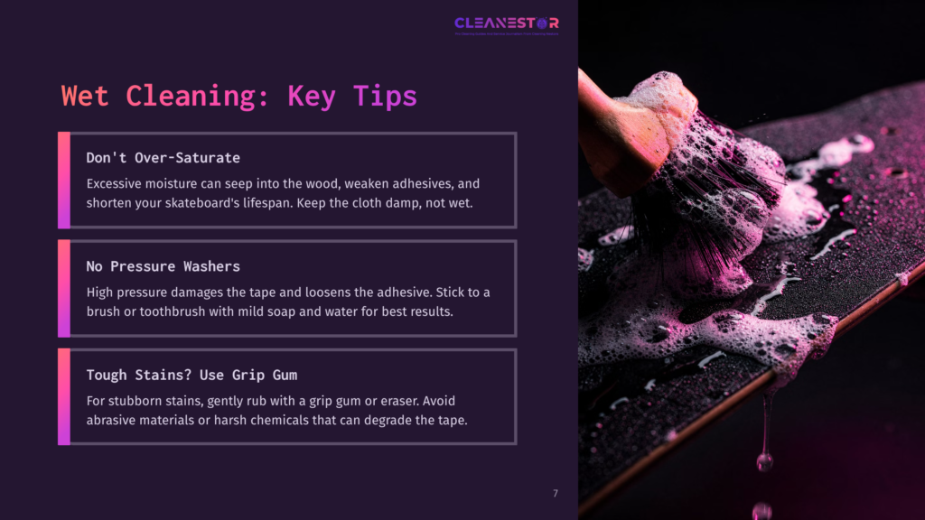 7 Wet Cleaning Key Tips Close-Up Of A Brush With Pink Bristles Covered In White Soap Suds, Gently Scrubbing A Skateboard Deck. The Wet, Dark Surface Of The Skateboard Is Visible, With Water Droplets And Suds Creating A Dynamic Cleaning Scene.