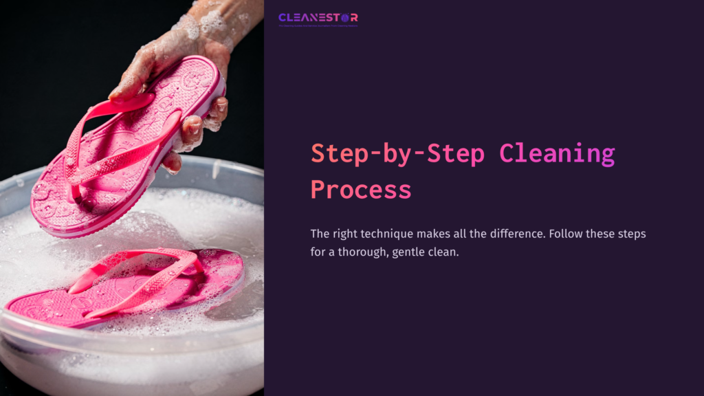 Pink Olukai Flip-Flops Are Being Lifted From A Soapy Bowl, Illustrating A Step-By-Step Cleaning Process With Gentle Washing Technique.