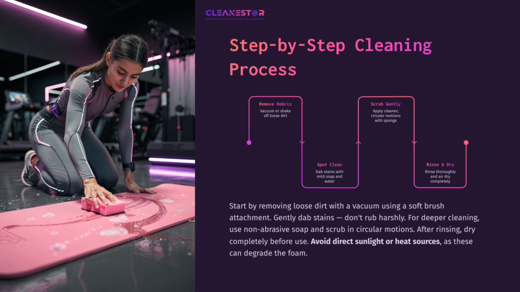 A Person Cleaning A Pink Foam Mat With A Pink Sponge In A Gym Setting, Surrounded By Exercise Equipment And Dim Lighting.