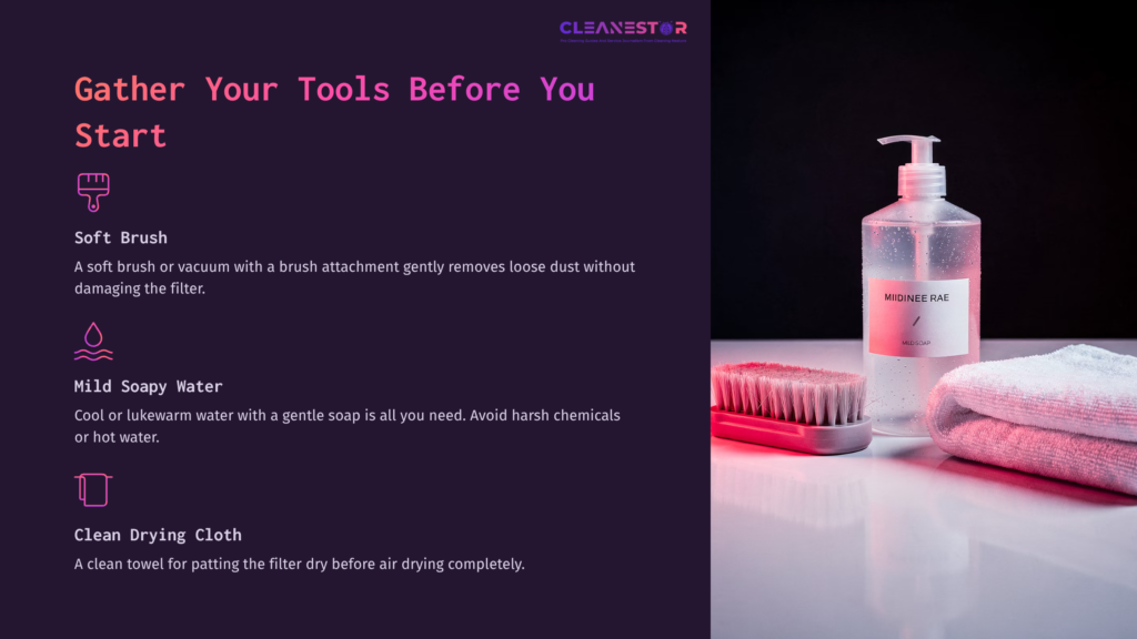 Tools For Cleaning A Bedjet Filter: A Soft Brush, Soap Dispenser With Mild Soapy Water, And A Drying Cloth On A Dark Background.